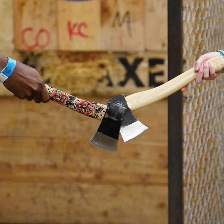 two humans tapping axes
